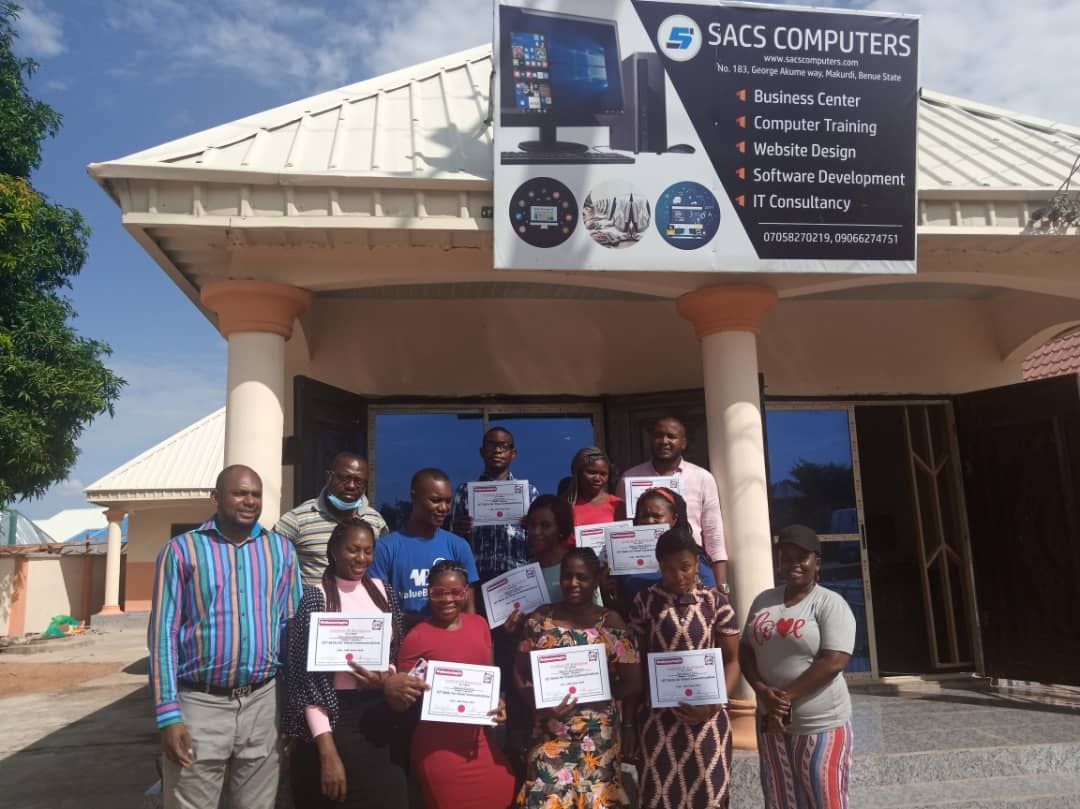 Trainees receive their certificates outside the SACS Computers Training Center